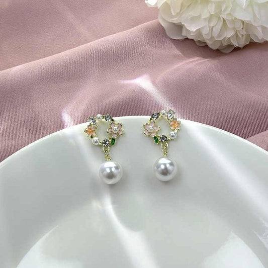 Korean style silver stud earrings with peach flower accents